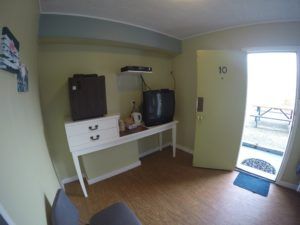 Entrance and tv area in room 10 at Jasper Way Inn in Clearwater
