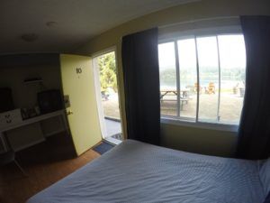View, entrance and bed in room 10 at Jasper Way Inn in Clearwater