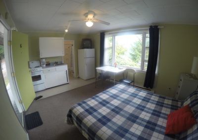 Entrance, sleeping, dining and kitchen area in Room at Jasper Way Inn lodging in Clearwater, BC