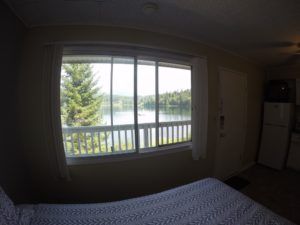 Bedroom and Lake view from in Room 7 at Jasper Way Inn lodging in Clearwater, BC