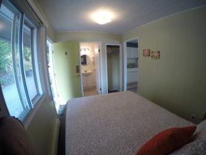 Sleeping area, entrance and bathroom areas in Room 8 at Jasper Way Inn lodging in Clearwater, BC