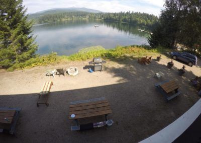 View of lake, and BBQ area from in Room 8 at Jasper Way Inn lodging in Clearwater, BC