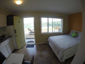 Sleeping, entrance and kitchen in Room 9 at Jasper Way Inn lodging in Clearwater, BC