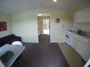 Entrance, dining and kitchen areas in Room 9 at Jasper Way Inn lodging in Clearwater, BC