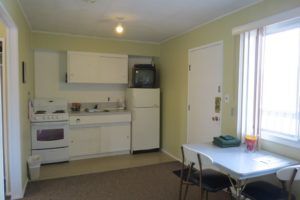 Kitchen, entrance and dining in Room 9 at Jasper Way Inn lodging in Clearwater, BC